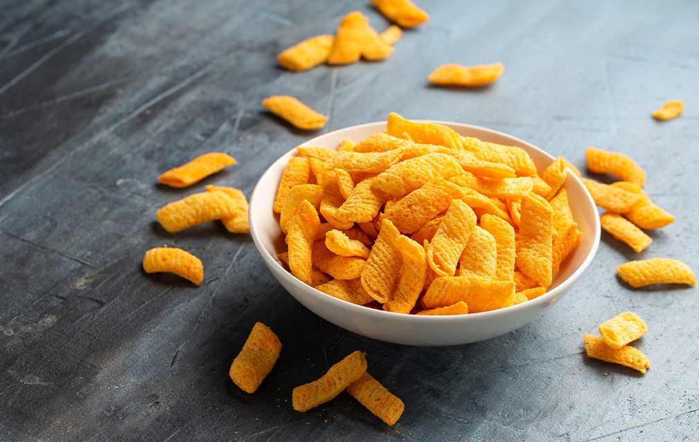 FoodRGB Beta Carotene Application photography for Snacks including puffed crackers in orange