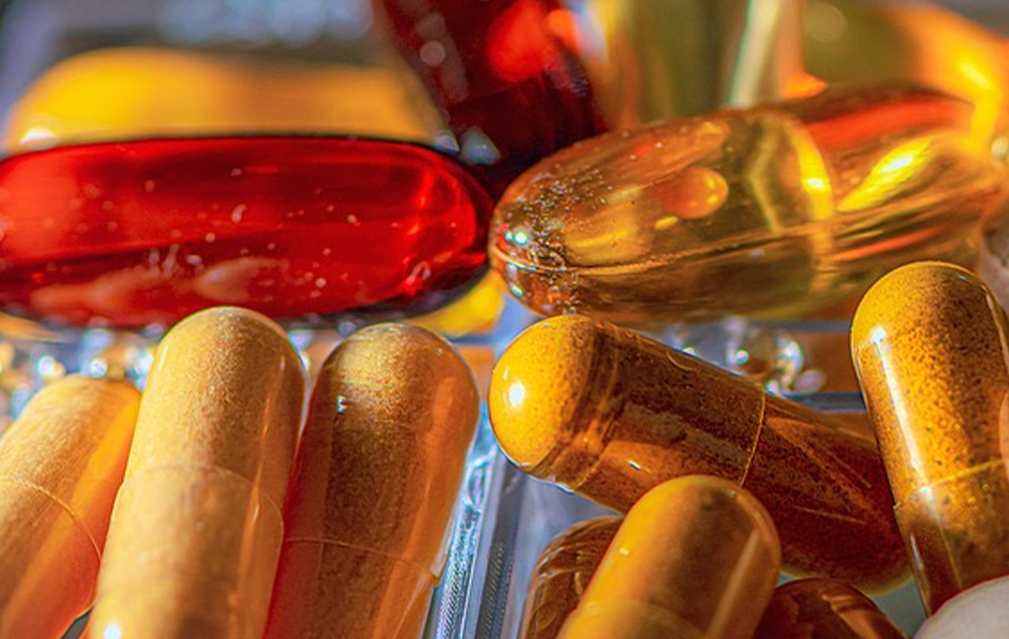 FoodRGB Natural food color application photography for nutraceuticals capsules using orange, red and yellow natural food color