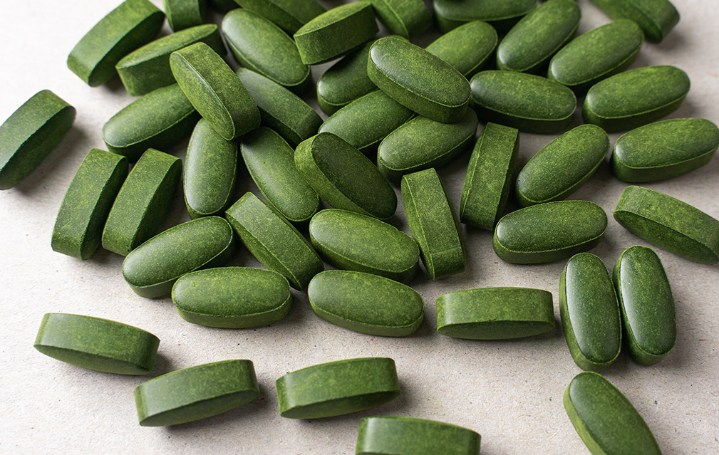 FoodRGB Natural food color application photography for nutraceuticals coated pills with green natural food color