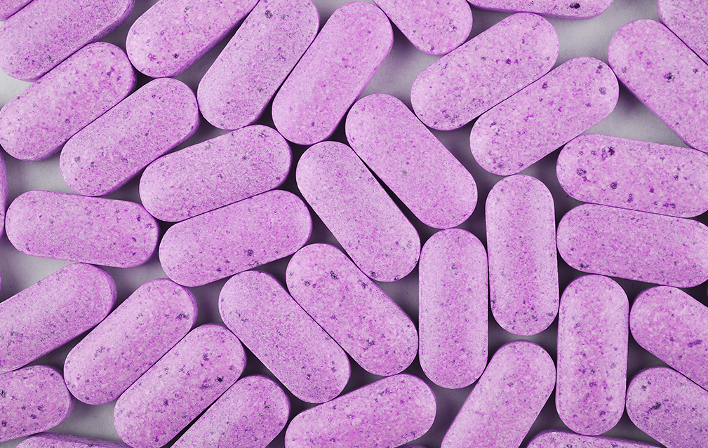 FoodRGB Natural food color application photography for nutraceuticals coated pills with purple natural food color